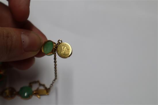 A Chinese 14k yellow metal, character link and cabochon jadeite set bracelet, gross 12.4 grams.